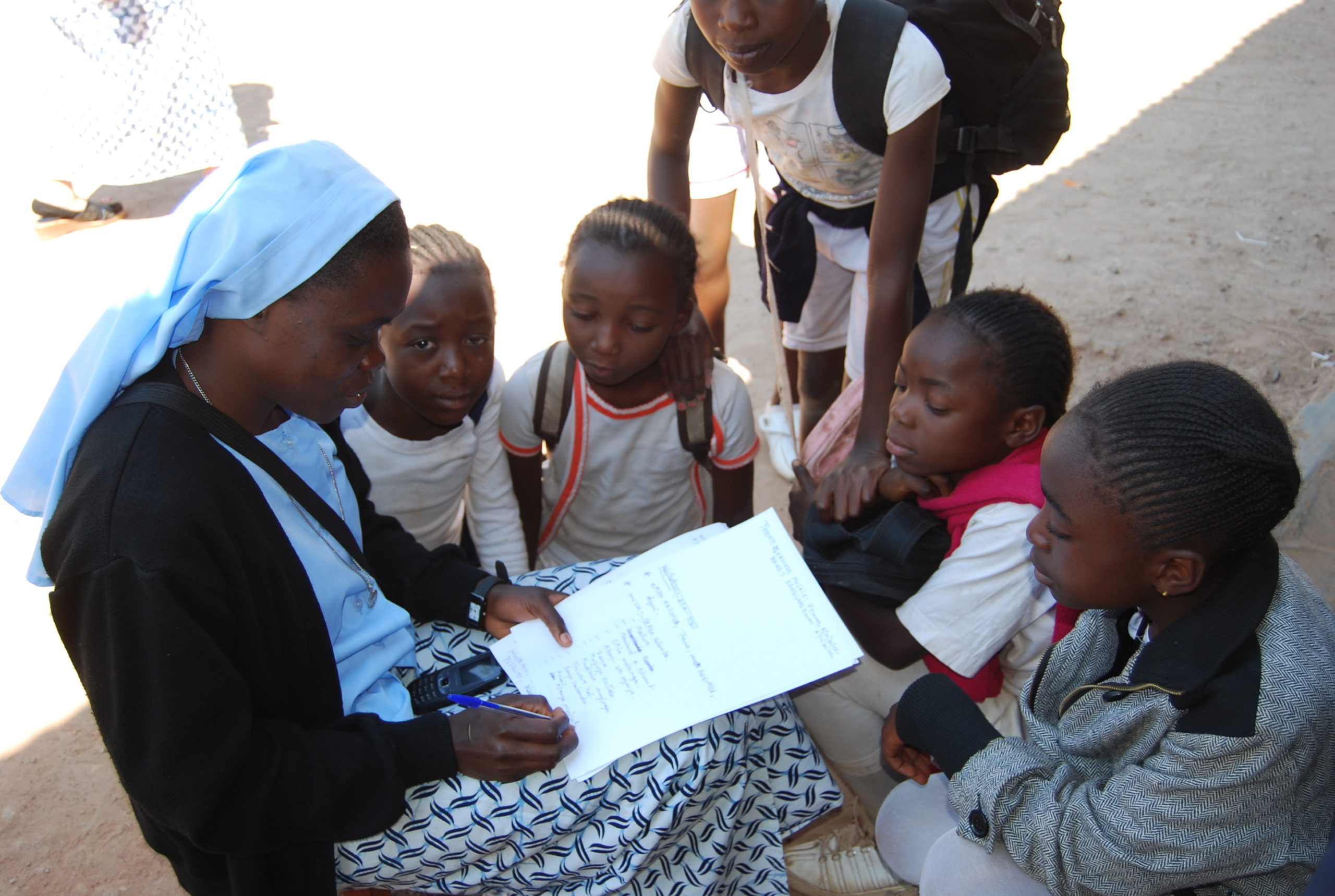 Congolese Salvatorian Sister reading to school children